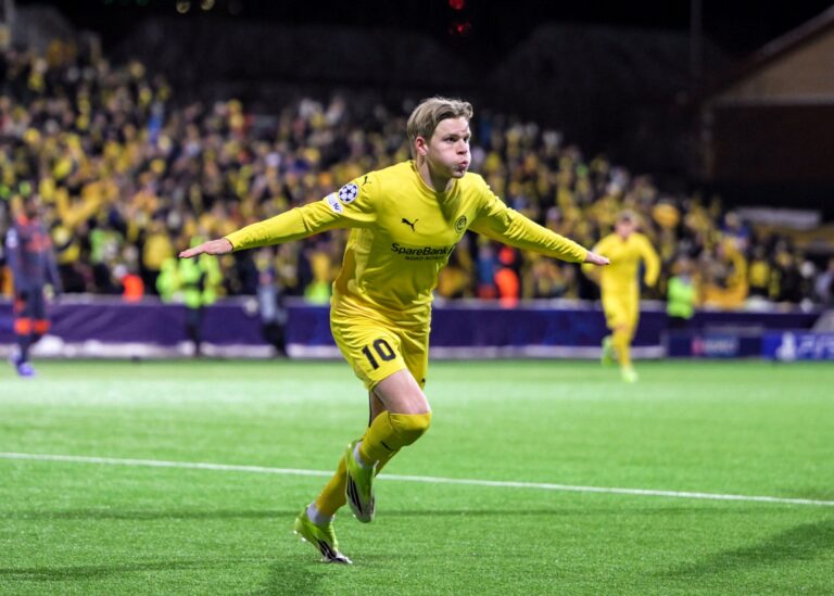 Jens Petter Hauge celebrates after scoring against Inter Milan during the first leg of the UEFA Champions League playoffs