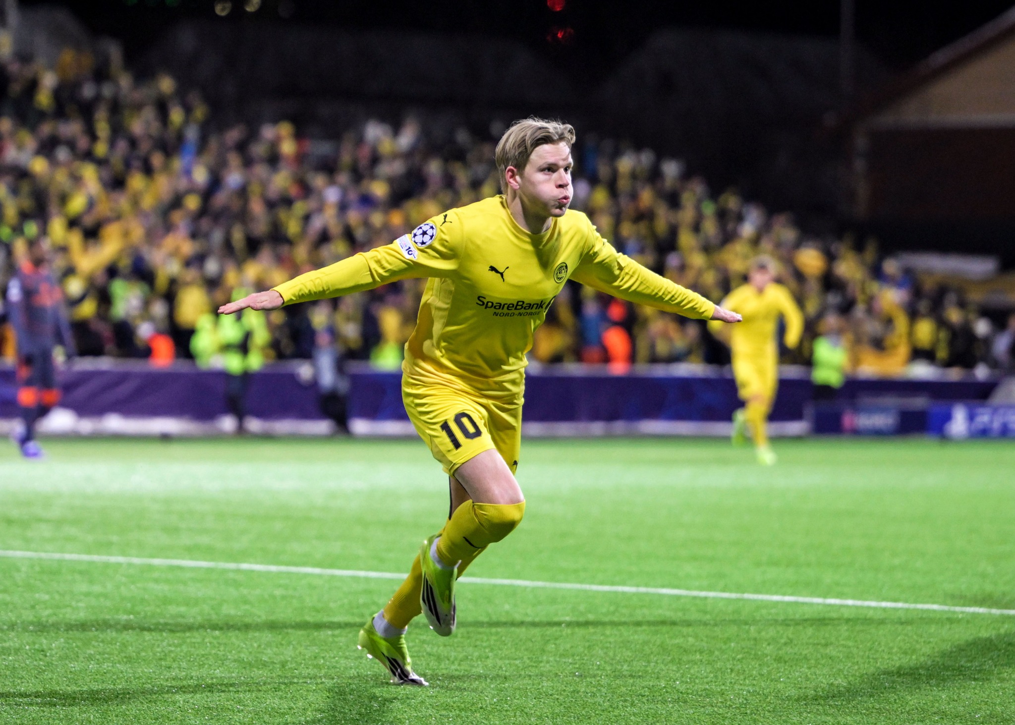 Jens Petter Hauge celebrates after scoring against Inter Milan during the first leg of the UEFA Champions League playoffs