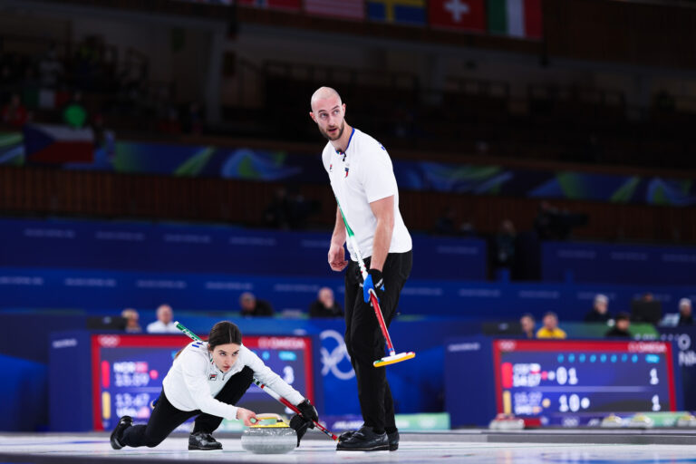 The Italian team during action in the mixed doubles event of the 2026 Olympic curling tournament featured image