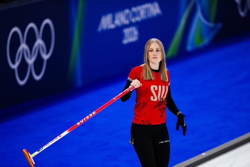 The Swiss team during action in the mixed doubles event of the 2026 Olympic curling tournament featured image