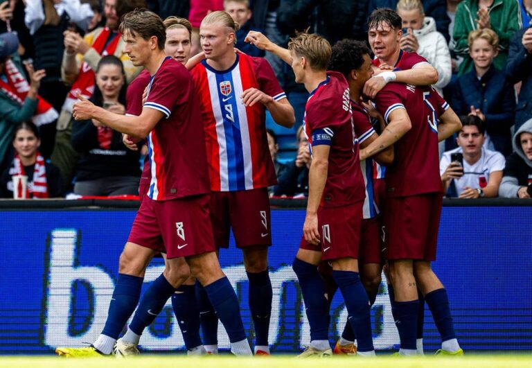 Erling Haaland (centre, #9) celebrates a goal with teammates during a match with Norway. World Cup Golden Boot featured image.