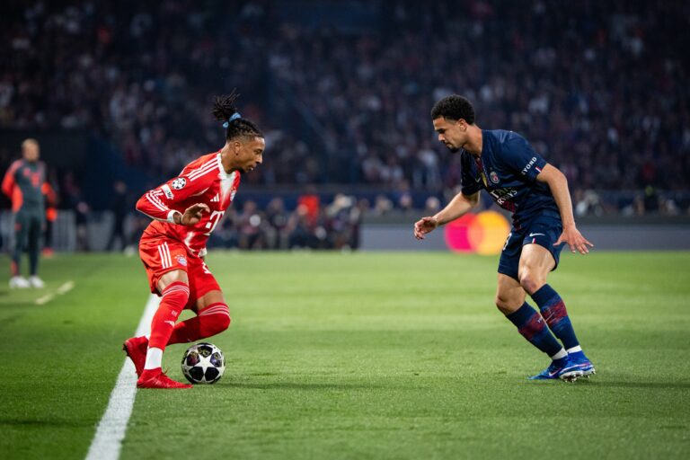 Michael Olise (left), from Bayern Munich, faces Warren Zaire-Emery (right), from PSG, during the first leg of the Champions League semi-finals.