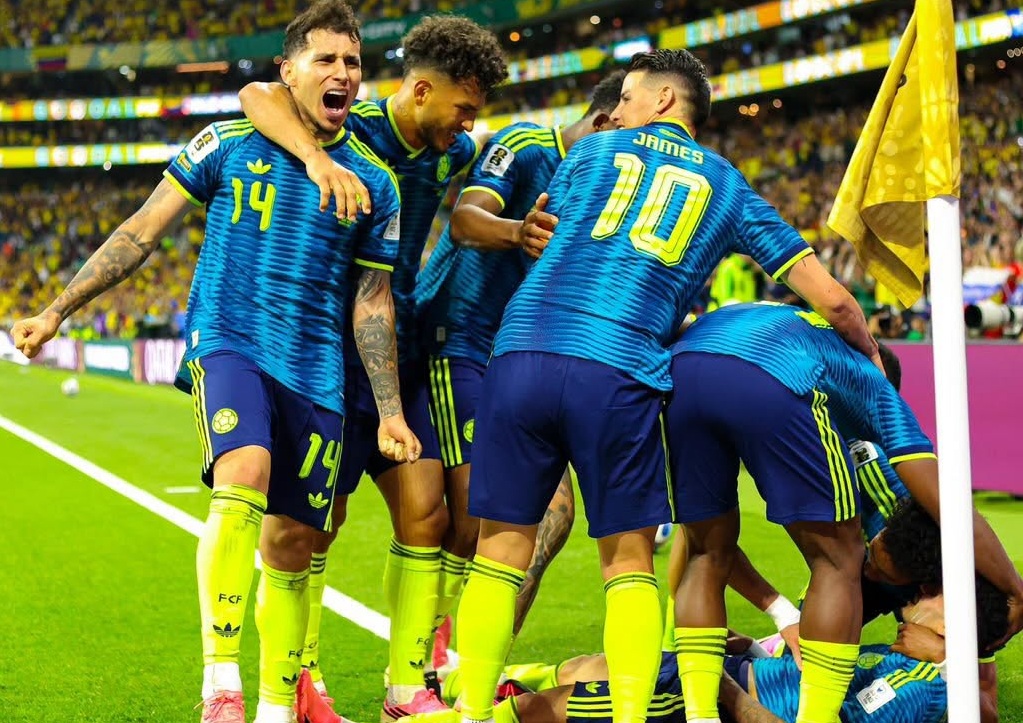 Colombian players celebrate a goal during their World Cup 2026 game against Uzbekistan. World Cup 2026 tips for day 13 & 14 featured image.