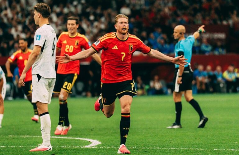 Kevin De Bruyne in Belgium’s red kit celebrates with arms outstretched during a football match against New Zealand. Belgium vs Senegal Round of 32 World Cup 2026 featured image.
